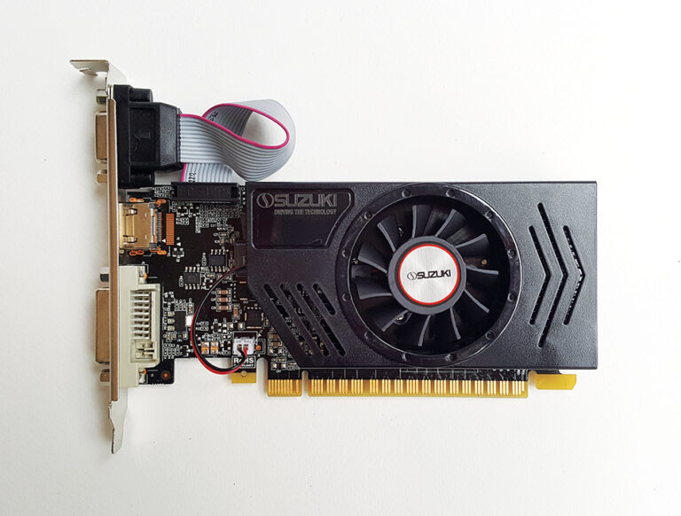 Black Suzuki graphics card with a single cooling fan, exposed PCB, and video ports on a white background.