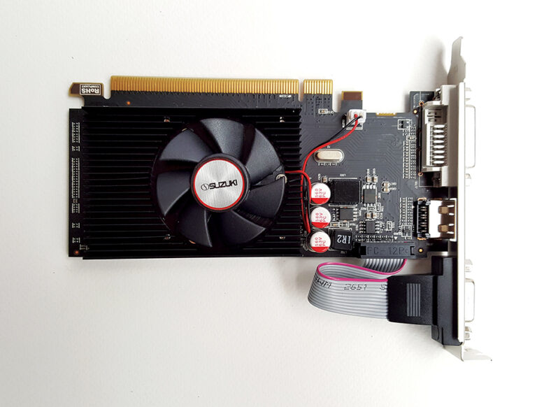 Black graphics card with a Suzuki cooling fan, capacitors, and video ports including HDMI and DVI on a white background.