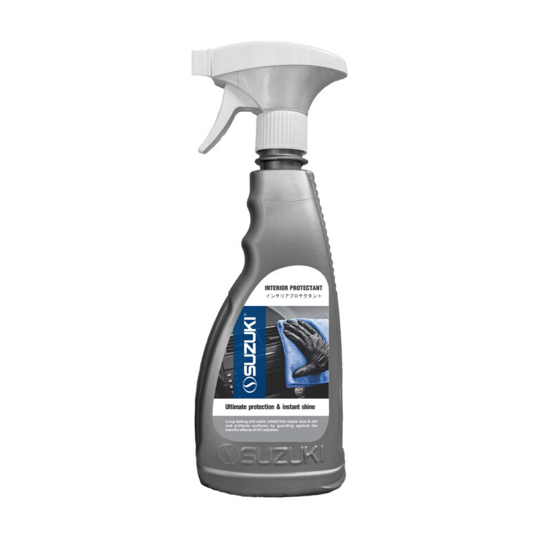Grey spray bottle of Suzuki Interior Protectant with a label showing a gloved hand wiping a dashboard.