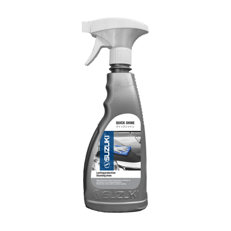 Grey Suzuki Quick Shine spray bottle with a white nozzle and label showing a hand wiping a car surface.