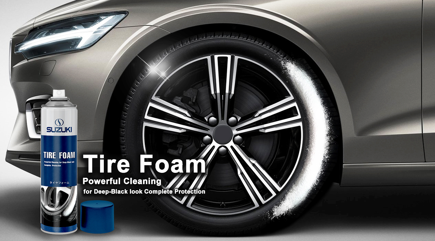 Silver car wheel with white tire foam applied and a blue Suzuki Tire Foam can nearby.