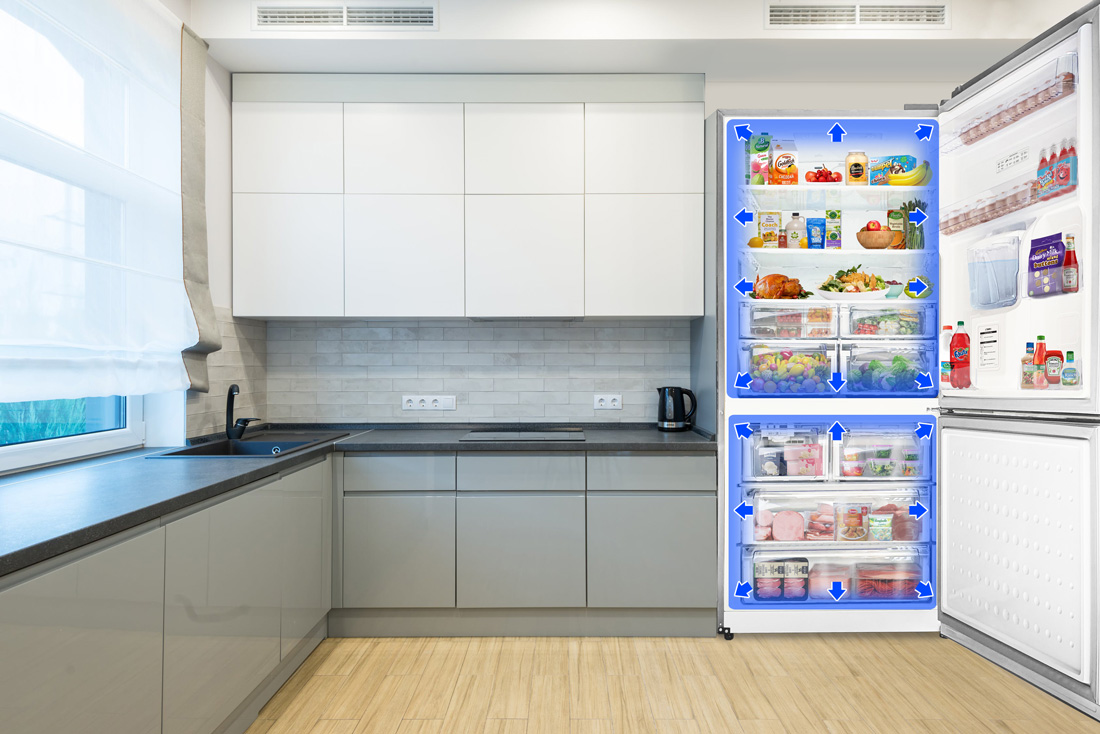 Open refrigerator in a modern kitchen with blue arrows indicating multi-airflow cooling circulation around fresh food.