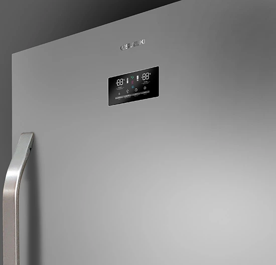 Close-up of the digital temperature display and control buttons on a silver Suzuki refrigerator door.