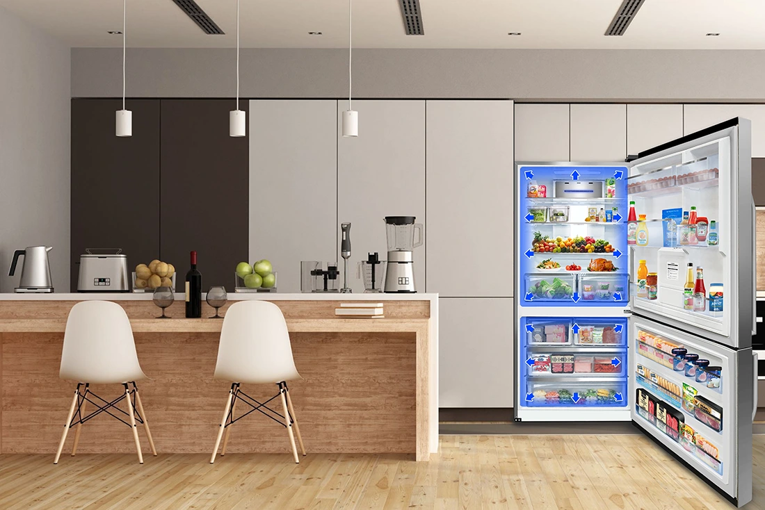 Open refrigerator in a modern kitchen displaying blue arrows indicating internal airflow circulation around fresh food and dr