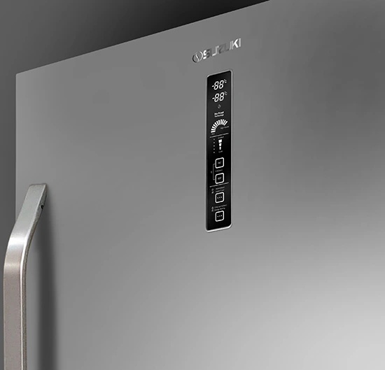 Vertical digital control panel with temperature display and touch buttons on a silver Suzuki refrigerator door next to a hand