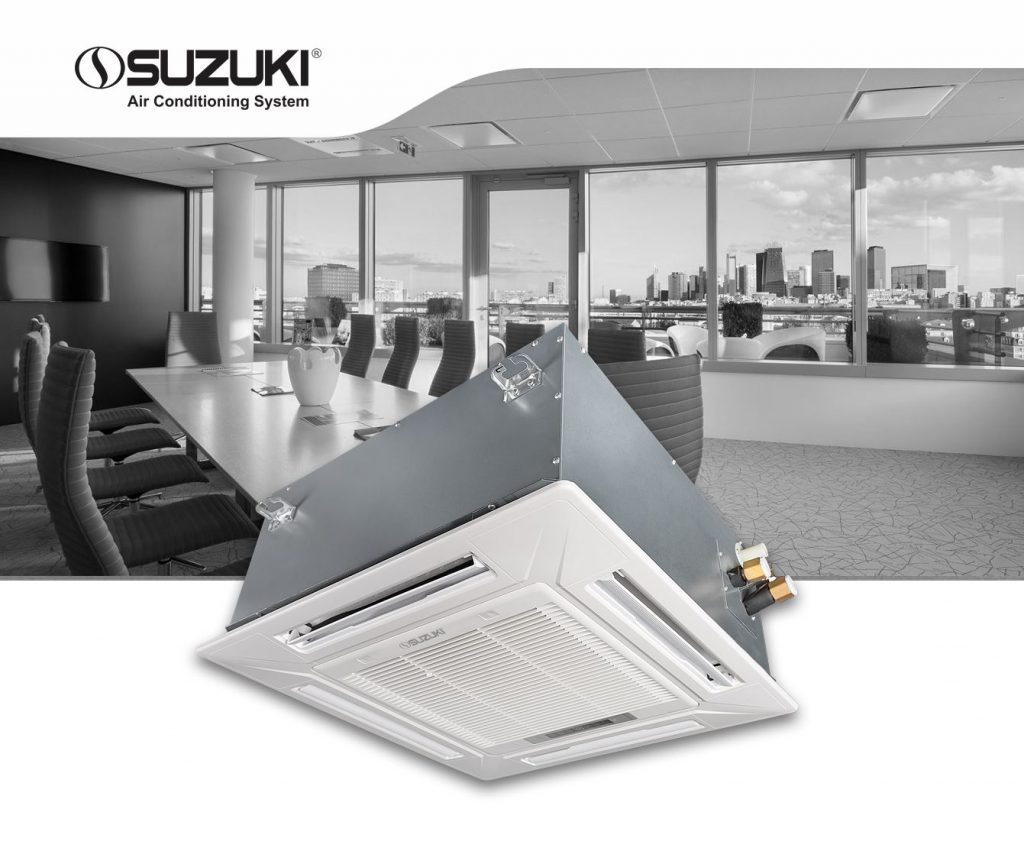 Suzuki ceiling cassette air conditioning unit positioned in front of a modern office conference room