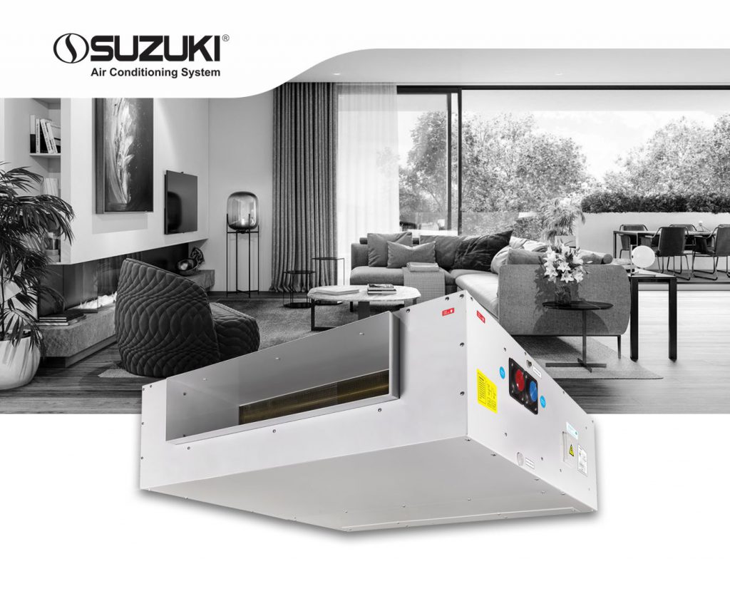Industrial Suzuki air conditioning unit positioned in front of a modern living room interior