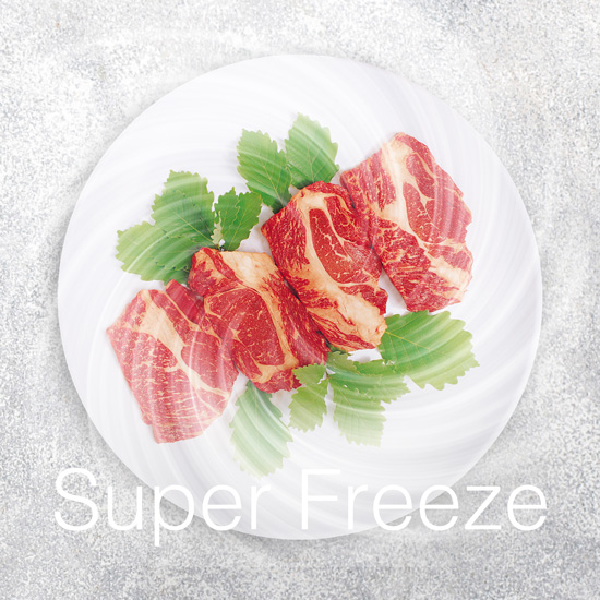 Slices of marbled raw beef arranged on a white plate with green leaves and Super Freeze text overlay