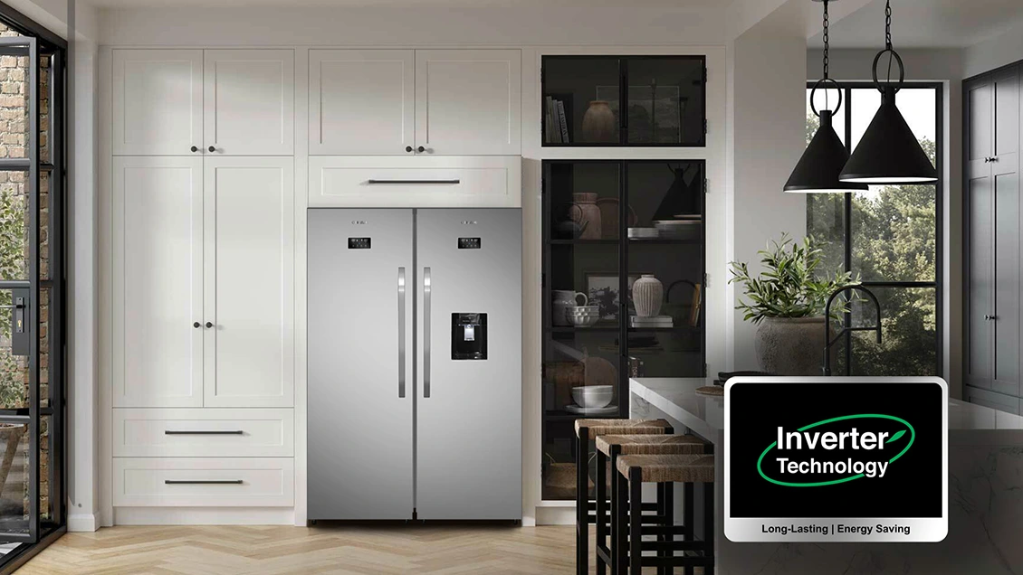 Stainless steel side-by-side refrigerator with water dispenser in a modern kitchen with white cabinets and black pendant ligh