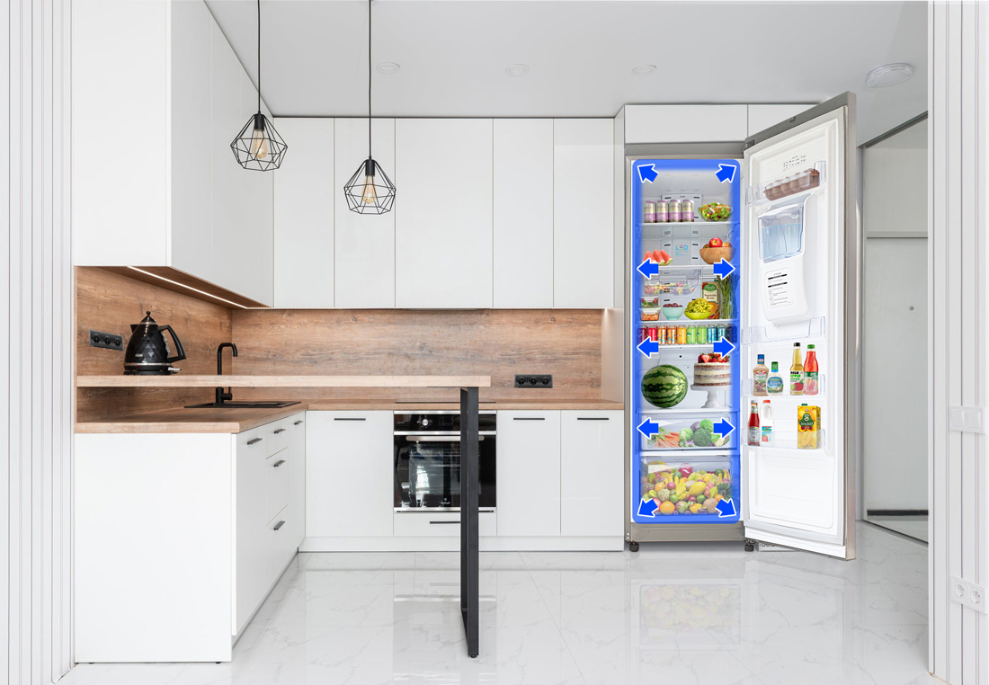Open refrigerator in a modern kitchen with blue arrows indicating internal airflow and cooling zones.