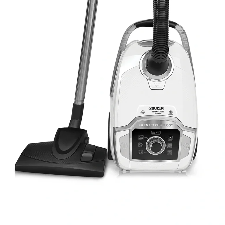 White Suzuki canister vacuum cleaner with silver extension tube and black floor nozzle attached